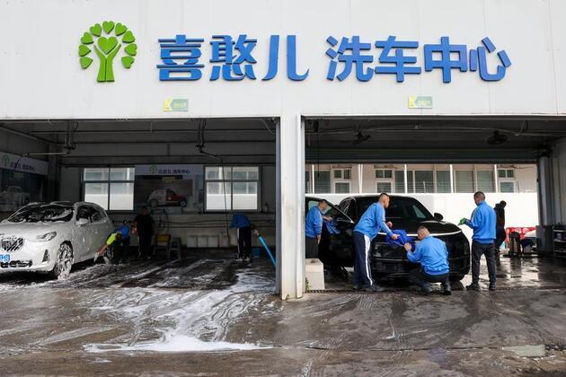 From a Shenzhen car wash, China's push for dignified work reaches some of its most vulnerable