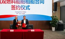 Emma Roberts (left) and Li Jin at the charter contract signing.