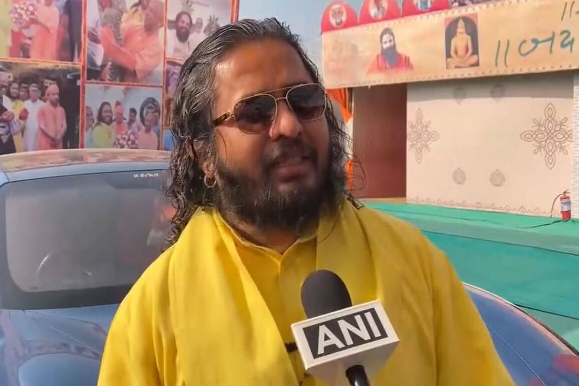 "Can't people who believe in spirituality ride in these cars?" Satua Baba over his luxury car collection at Magh Mela