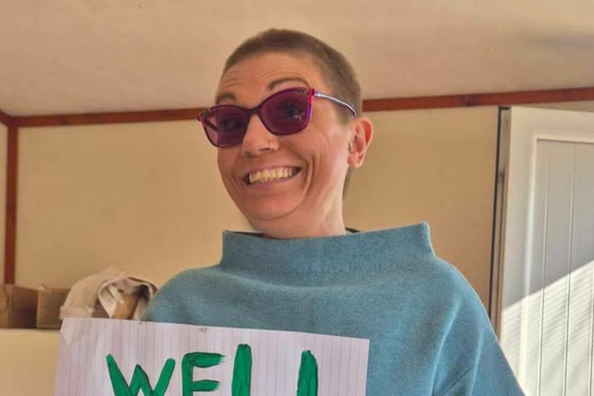 Woman raises thousands after shaving off her hair for Lisburn cat charity