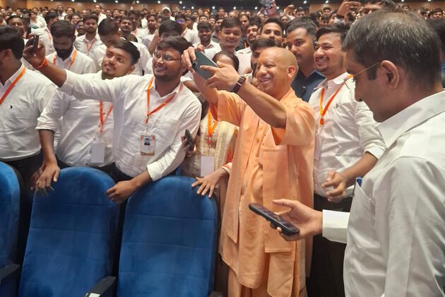 UP CM Yogi Adityanath takes selfies with youth after distribution of appointment letters