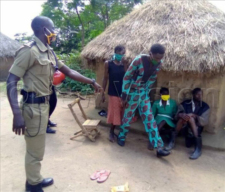 A police officer effecting arrest of Christians who are alleged to gathering for prayers which is against the government measures to stop the spread of COVID-19. Photo by Micheal Onyinge