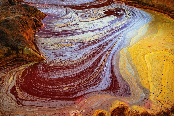 A palette of colors produced by the various metals extracted through mining and bacterial activity in the acidic waters of the river Tinto at its headwaters.