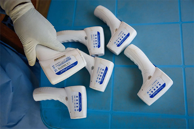  oncontact thermometers allow health workers to check the temperature of people bola screening points etty mages
