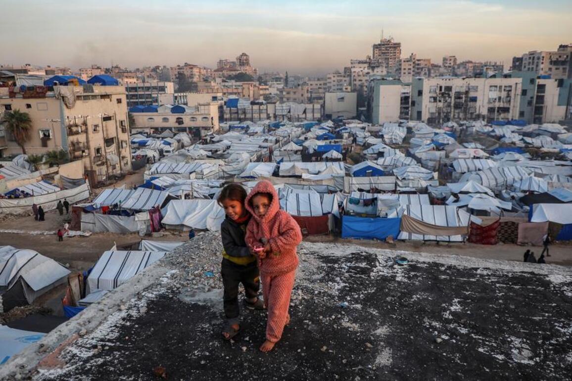 Gaza families salvage iron from ruins to reinforce tents as winter storms hit
