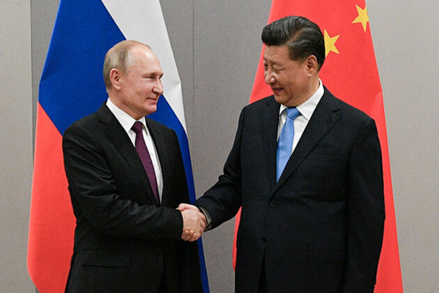 Putin hails 'unprecedentedly high level' of Russia-China ties with major pipeline agreement