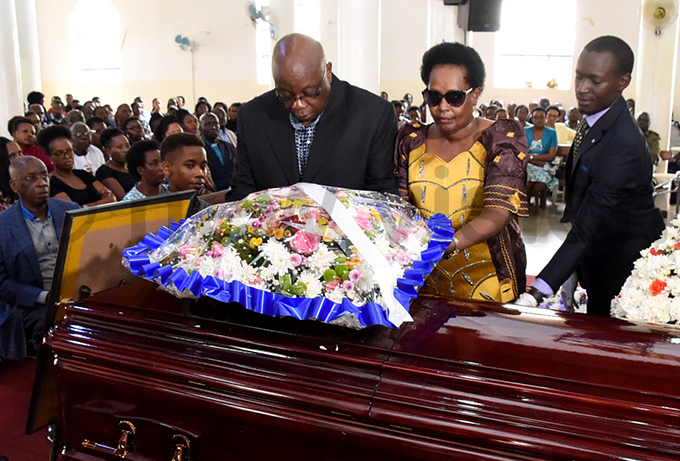 he deceaseds parents lay a wreath on the casket containing his remains hoto by palanyi sentongo