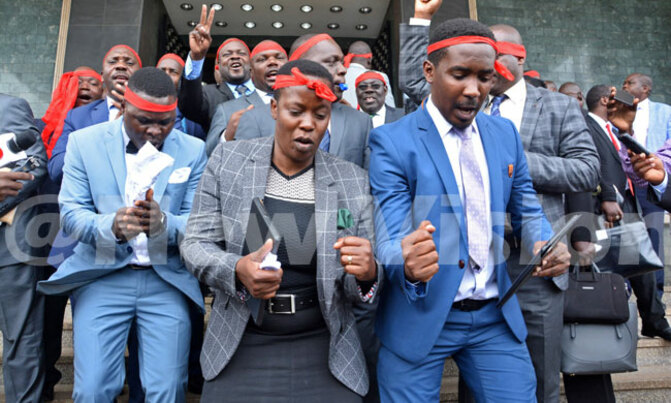 Opposition MPs wear symbolic red head bands in protest Opposition MPs wear symbolic red head bands in protest