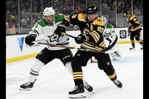 Brad Marchand nets pair as Bruins open season with win