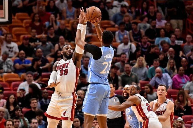 Wolves end 5-game skid by toppling host Heat