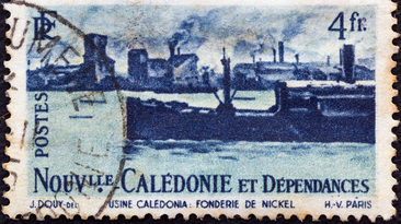 NEW CALEDONIA - CIRCA 1948: A stamp printed in France shows Nickel foundry and ship.