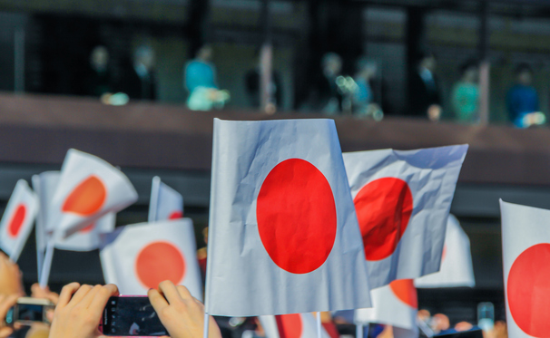 People with national flags in the park in Tokyo, Japan Credit: istock/ dimakig