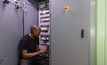 Chris Ngobeni, winding assistant at Marthinusen & Coutts, performing final checks on the generator rotor panel