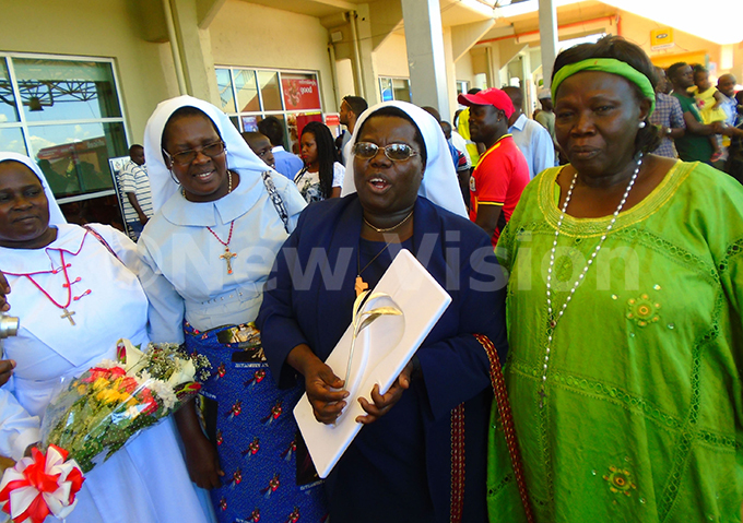   r yirumbe third left with her big sister on atherine avenjina and fellow nuns upon her arrival at ntebbe irport on aturday