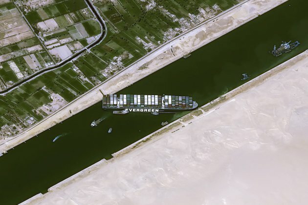 Egypt Works to Refloat Container Ship Blocking Suez Canal for 2nd Day