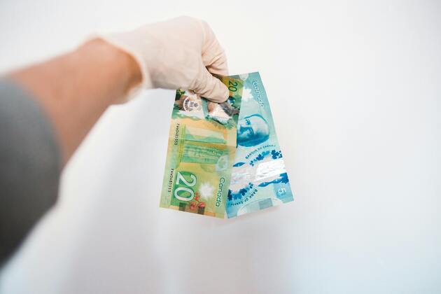 Loonie slides as traders await next week's rate decision