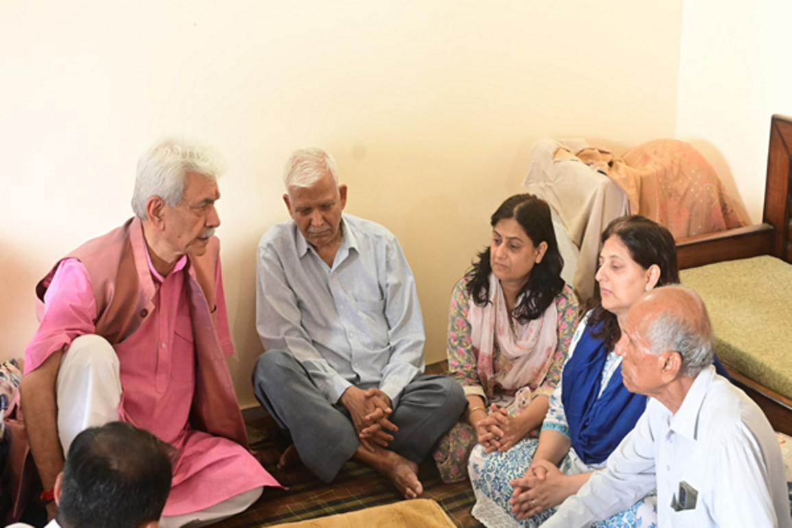 J&K LG Manoj Sinha meets family of ADDC Raj Kumar Thapa, who died in cross-border shelling
