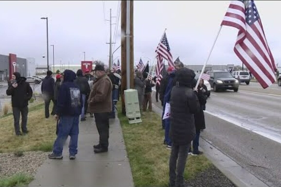 Man arrested after striking Tesla Takedown counter-protester with vehicle