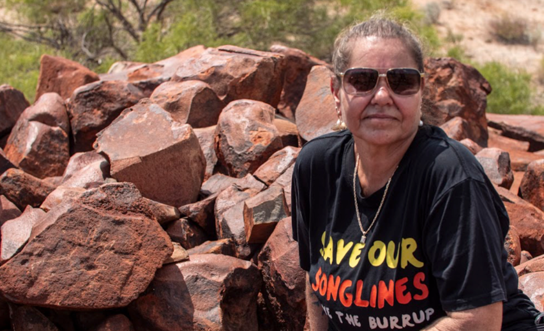 Raelene Cooper and hand petroglyph