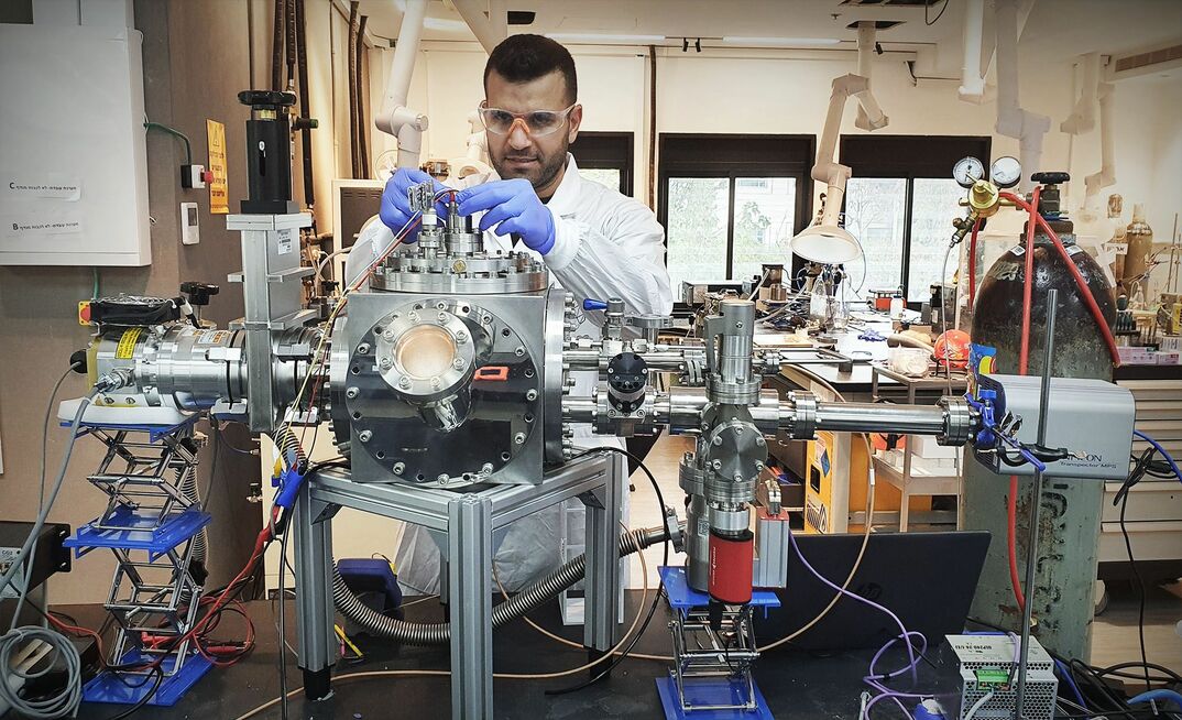 A Helios technician conducting molten regolith electrolysis.