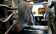 Axiom MD Jim Grose and DST’s Ben Barona examining the injection moulding die used to manufacture face mask strut components in support of Operation COVID-19 Assist.