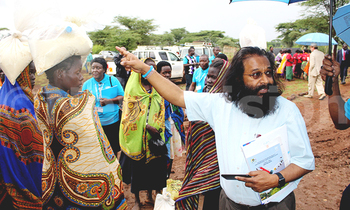 Blair tuamsie counsellor undp unfpa unops joint borad serving food to pupils of kalasi girls catholic primary school 3 350x210