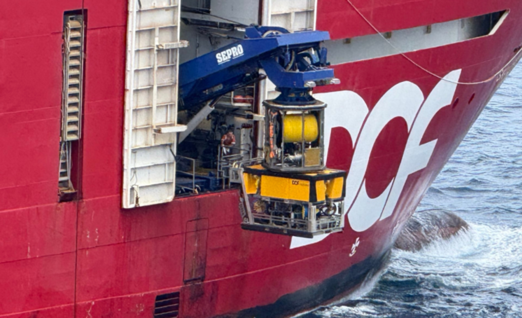 The Skandi Hercules lowers a remote operated vehicle (ROV) out of a hanger to cut the risers