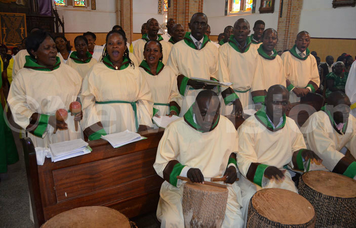  he choir from t osephs atholic parish ansana leading the singing during the hrism mass at ubaga athedral on oly hursday