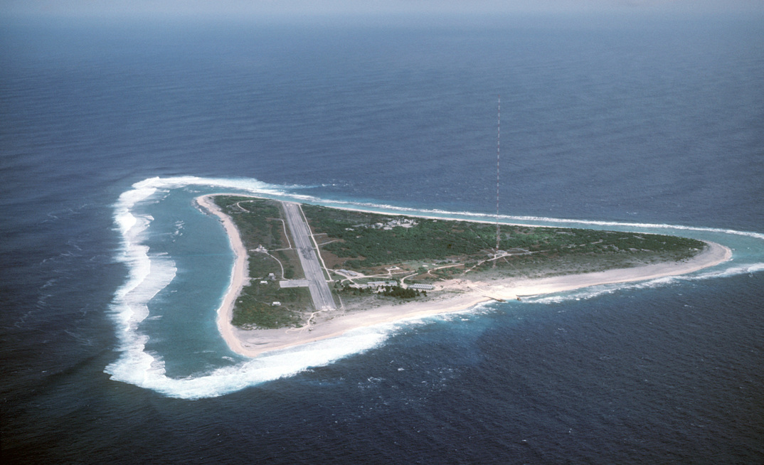 Aerial view of Minamitori Island (Minami-Torishima), Japan. There is a runway which supported the US Coast Guard station located there prior to 1993. Minamitori Island is the easternmost island of the Japanese archipelago.