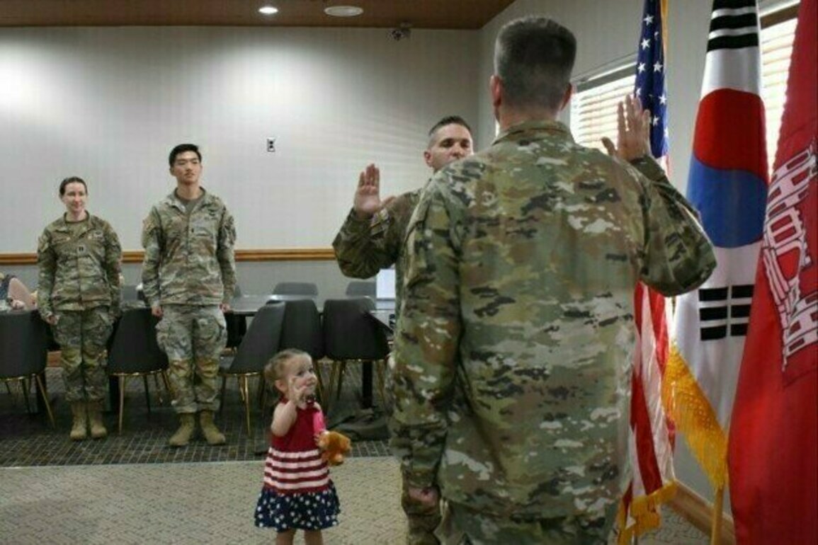 Army engineer reenlists with his daughter at his side in South Korea