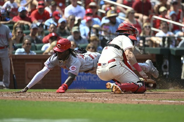 Reds smoke Cardinals 8-4 behind rookie hurler