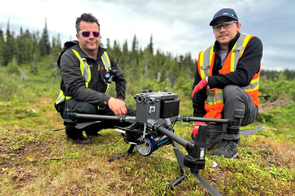 Altomaxx technicians prepare a DJI M350 RTK drone and gamma-ray spectrometer for a survey 