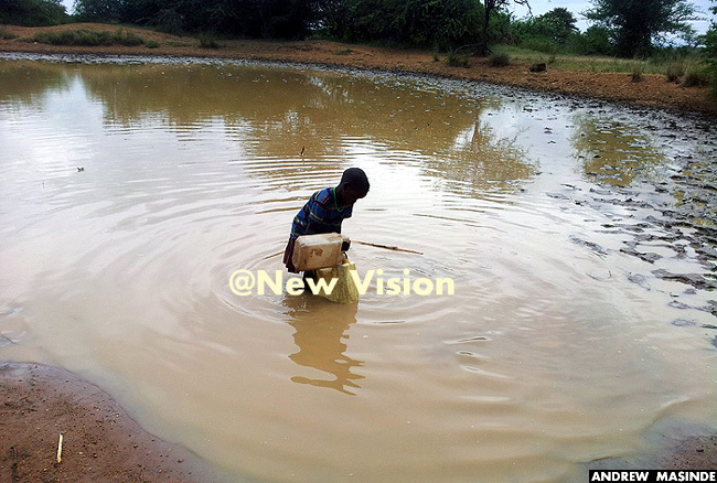   young girl fetching dirty water from a stream in oroto district
