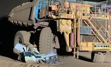 The haul truck squashed the smaller vehicle