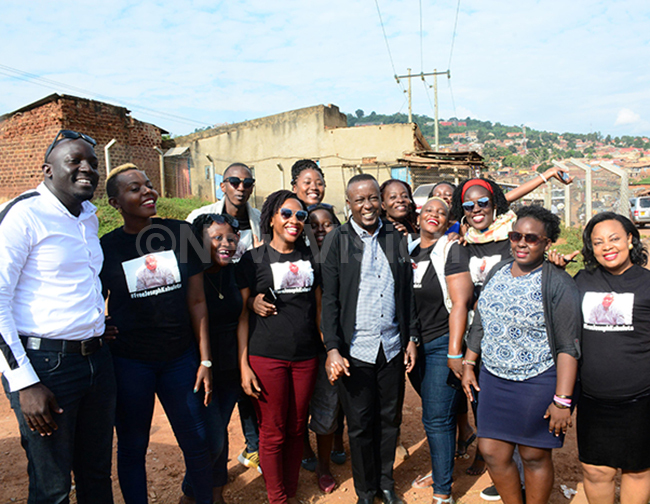  atchman inistries pastor oseph abuleta middle posing for a photograph with fans and members of his hurch at ireka after reporting to the pecial nvestigations irectorate to answer his bonduly 182019 hoto by ddie sejjoba