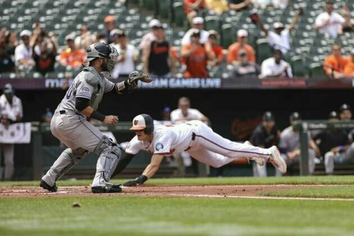 Rockies DFA C Austin Nola, recall RHP Chase Dollander