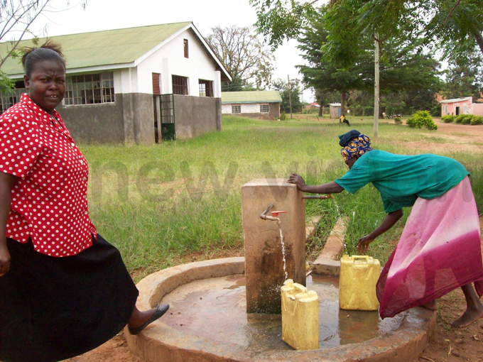illagers draw water from communal source set up last year at the school