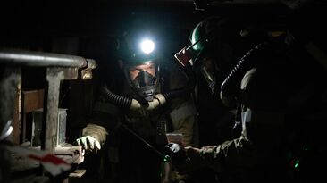 Volunteers undertaking underground mine rescue training.