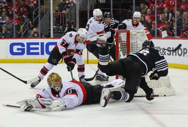 Senators end skid with victory over Devils