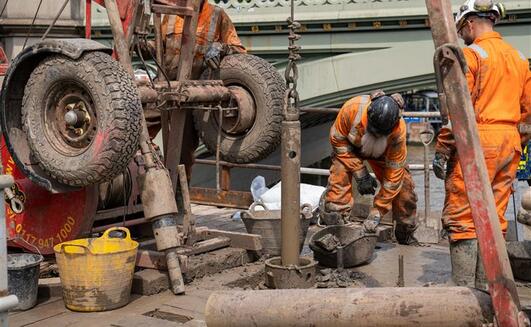 Engineers from Structural Soils conducted overwater drilling beside the Palace of Westminster using a jack-up barge on the River Thames