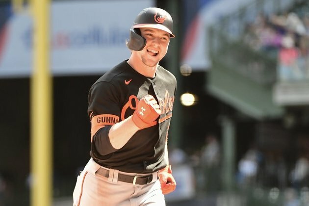 Orioles rally late to upend Brewers, salvage finale