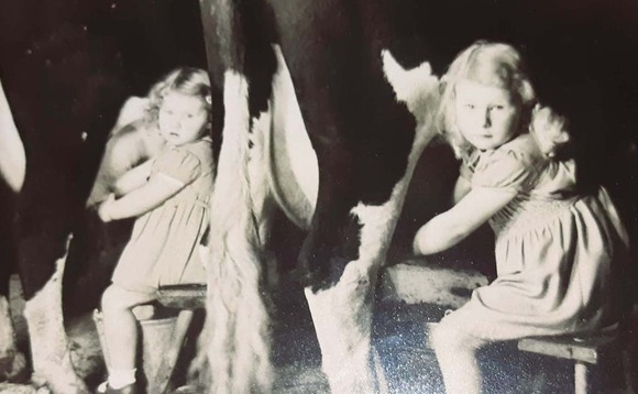 Historyveraandkathleengeehelpingtheirfatherkengeemilkthecows main 580x358.jpg