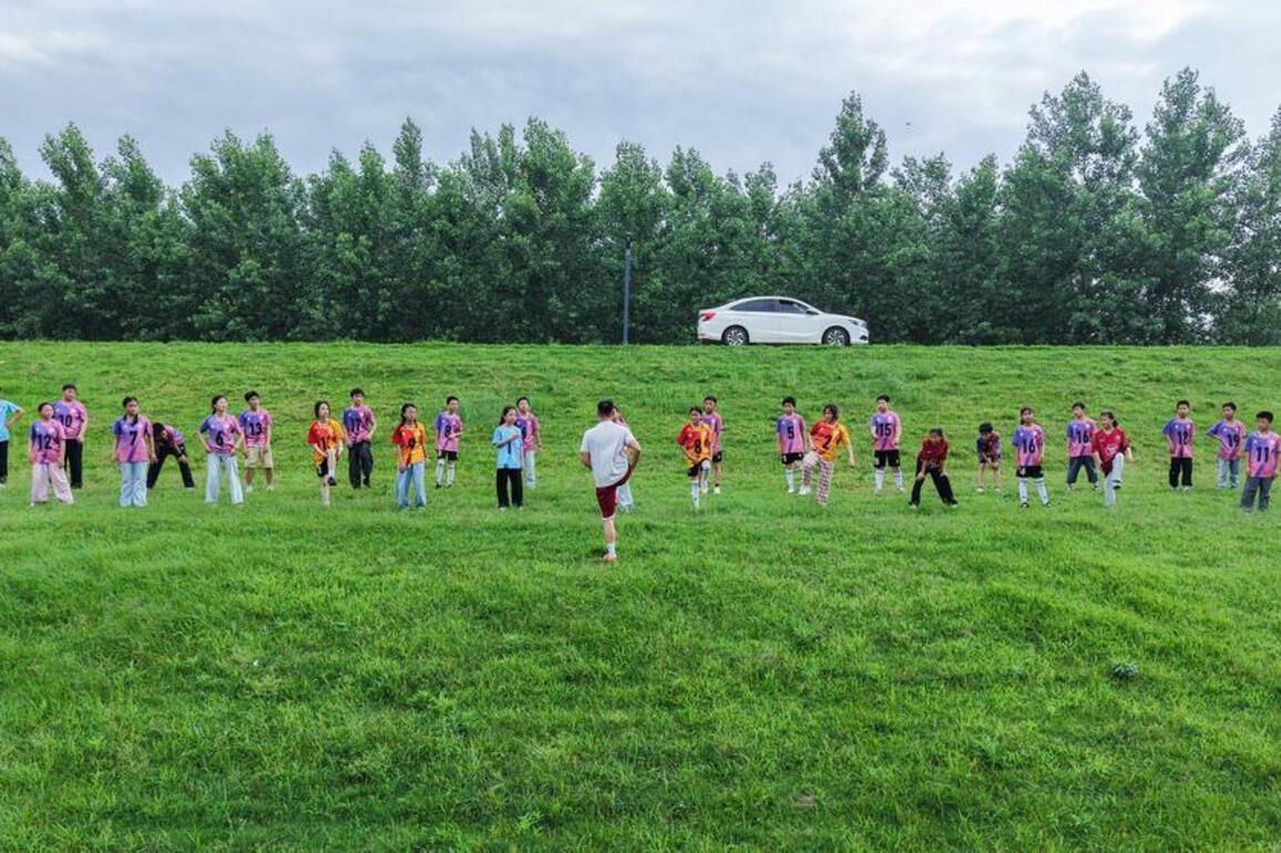 Along Yangtze dike, rural children chase football dreams