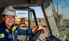 Ella Graham behind the wheel of a Cat haul truck at New Acland. Credit: New Hope Group