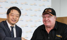 Arrow Energy CEO, Zhengxin Peng (left) and Silver City Drilling owner and director Viv Oldfield celebrate the new contract.