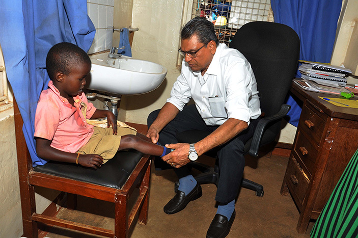  he senior rthopedic doctor rathur  attends to a paralysed aniel iplangat8 a  pupil of ampala chool of hysically handicapped  during the cross examination for surgery at ulago ospital on riday ugust 2016 