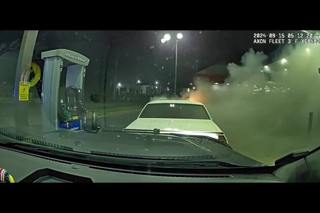 Video- Ga. officer uses cruiser to push flame-engulfed vehicle away from fuel pumps