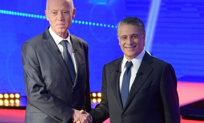 Media mogul, academic face off as Tunisians choose president Media mogul, academic face off as Tunisians choose president