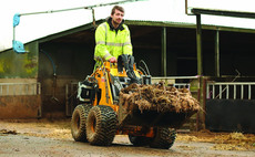 Small stand-on skid steer loader saves time