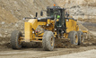 The new Cat 18M3 motor grader blades a pit road